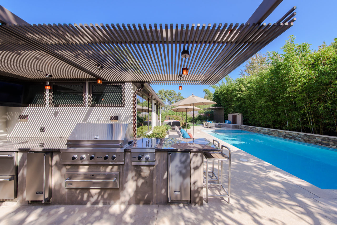 Steel trellis over outdoor kitchen and bbq area