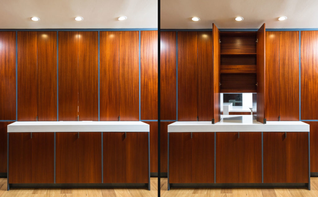 Hidden pass through door in custom dining room kitchen cabinets