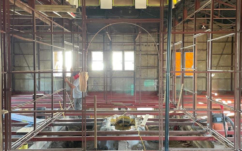 Rebuilding and reconfiguring of all-steel Pacific Palisades home with original stain glass transom windows in what will be the new center hall.