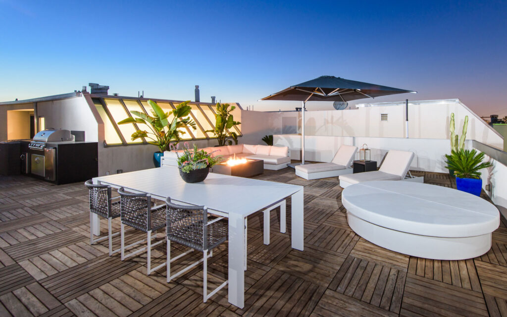 Rooftop, al fresco dining in Marina Del Ray. Floating ipe wood tiles on pedestal decking system