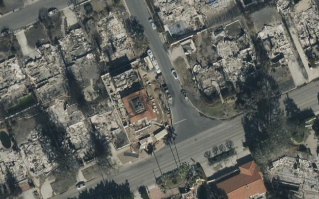 Aerial view of fire devastation through Pacific Palisades with on a few remaining homes left